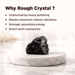 Rough crystal on a marble stand with text explaining benefits of using rough crystals.