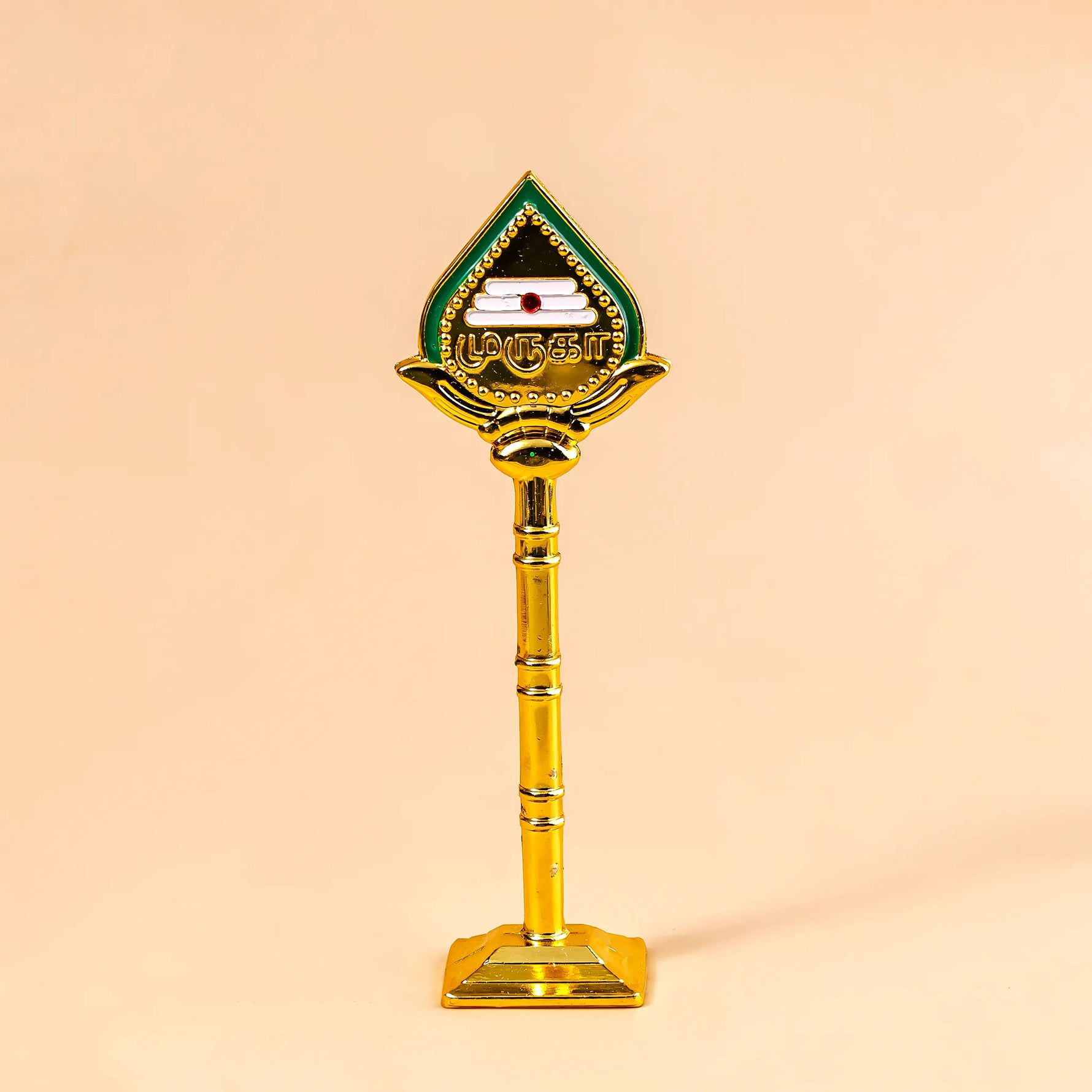 Decorative object with a green and gold design on a beige backgroundMurugan Vel – Divine Protection & Victory Symbol | Abhimantrit & Certified
