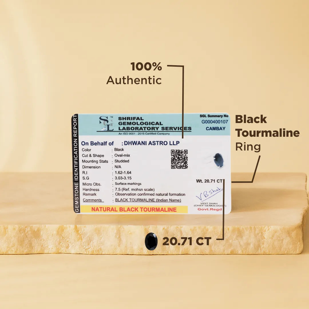 Black tourmaline ring with certification label on a beige background