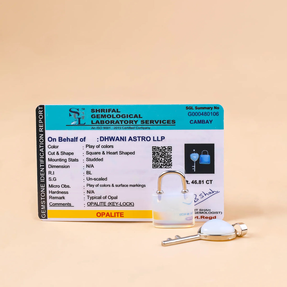 Opalite gemstone identification report with a key on a beige background