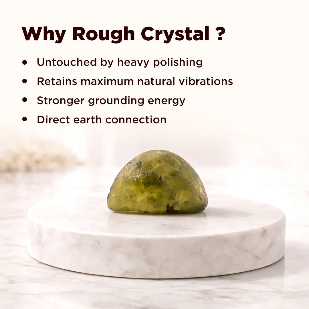 Rough crystal on a marble stand with text explaining benefitsRough Natural Moldavite – Rare Transformation & High Vibration Stone