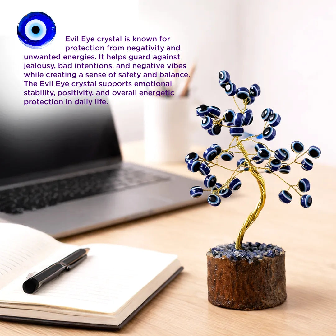 Evil Eye crystal tree on a desk with laptop and notebookEvil Eye Tree – Protection from Negative Energy & Nazar