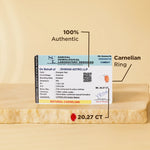 Carnelian ring with a certification label on a beige background