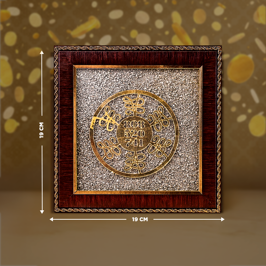 Decorative wall art with gold circular design and wooden frame, shown with measurements on a brown background.Numerology Healing Yantra Raw Pyrite Frame - Energy Balance & Prosperity Frame