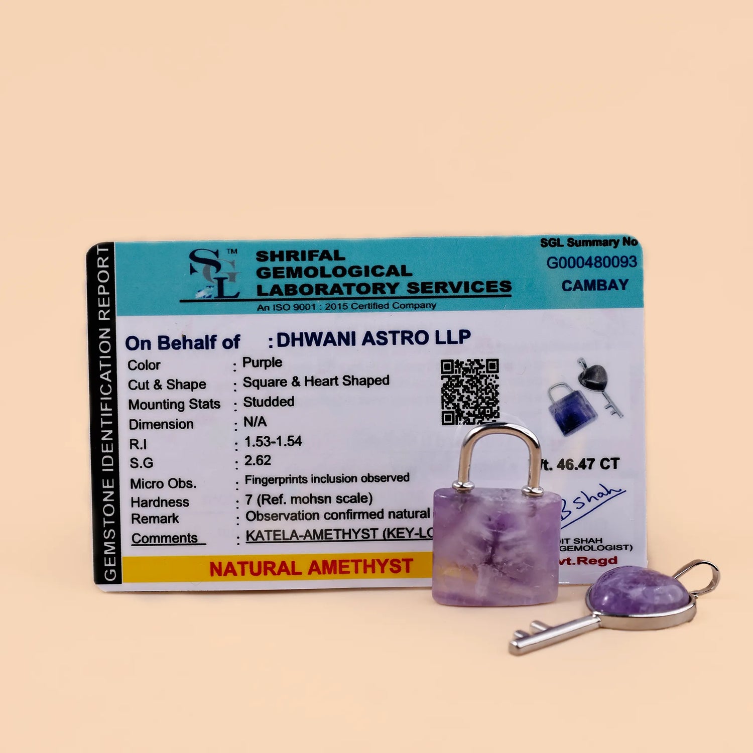 Amethyst keychain with a Shriraf Gemological Laboratory Services report on a beige background