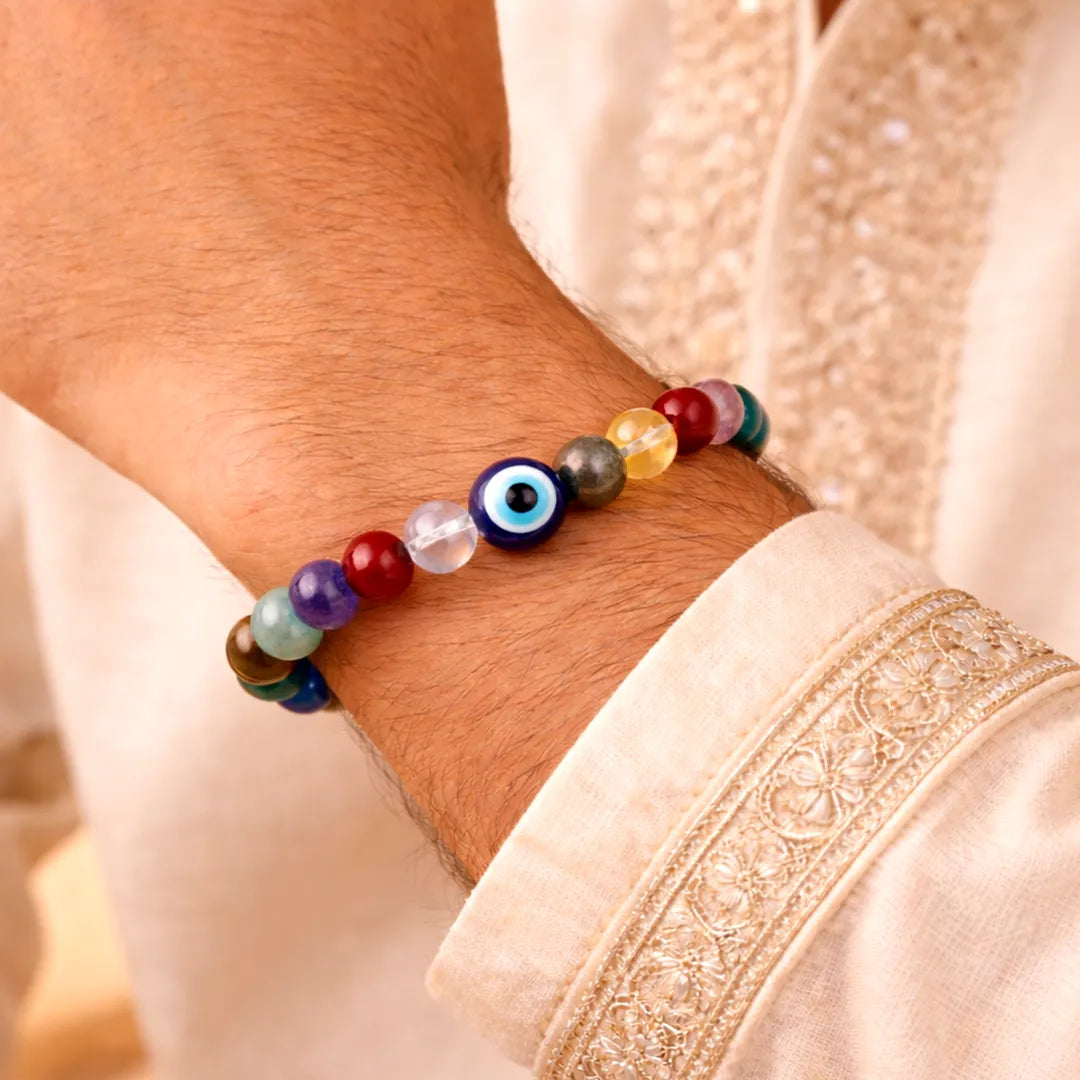 Multicolored beaded bracelet on a wrist with a neutral background