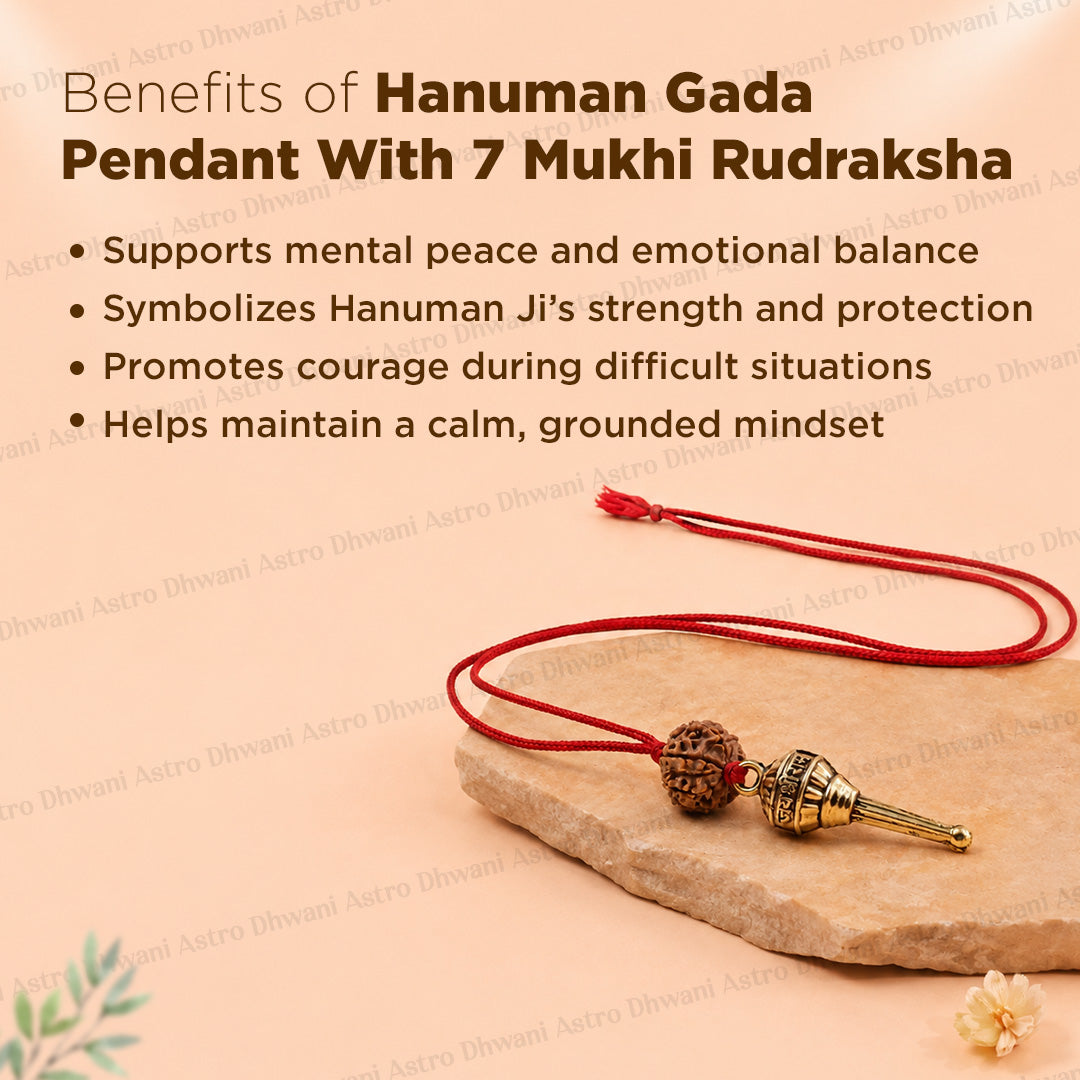 A red cord Hanuman Gada pendant with a 7 Mukhi Rudraksha bead and a gold-toned metal tip, displayed on a stone slab with promotional text about its spiritual benefits.