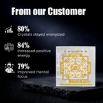 Crystal with gold engraving on a dark background, featuring customer feedback statistics.