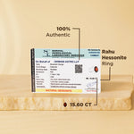 Rahu Hessonite ring with certification label on a beige background