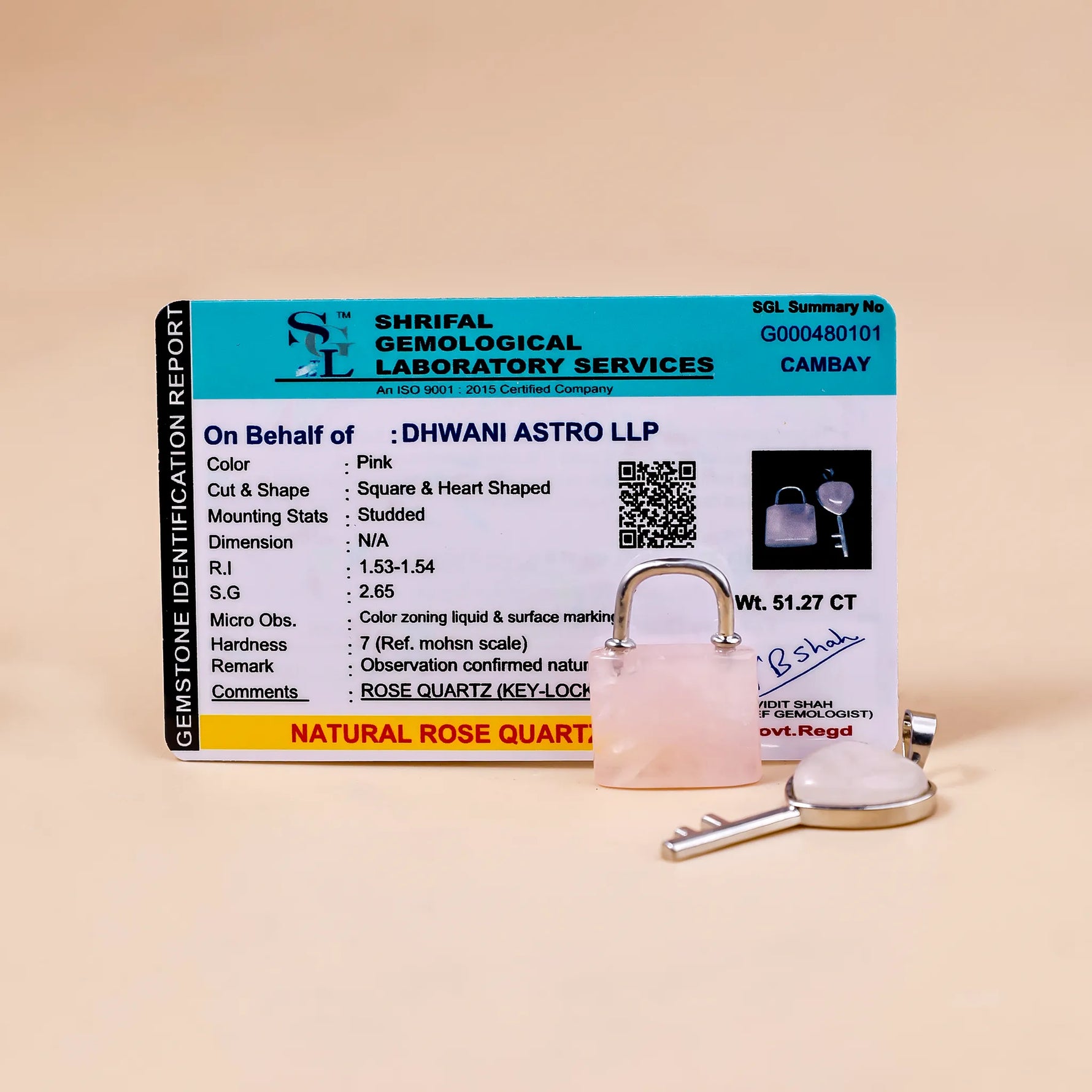 Shriful Gemological Laboratory Services identification card for a natural rose quartz stone on a beige background.Rose Quartz Lock And Key Pendant - Abhimantrit & Certified