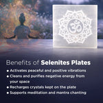 Selenite plate with Om symbol on a blurred meditation scene background