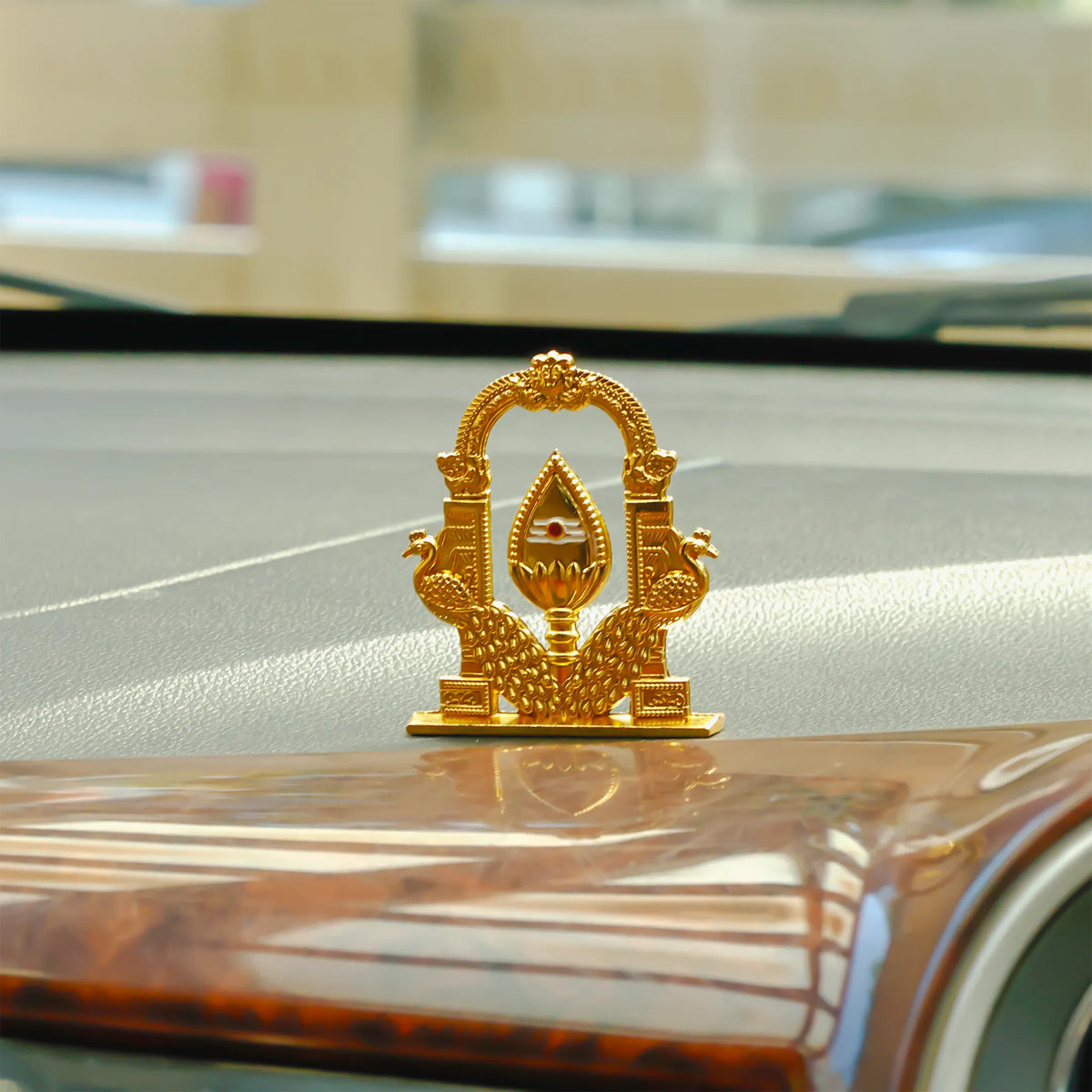 Gold decorative emblem on a car hood