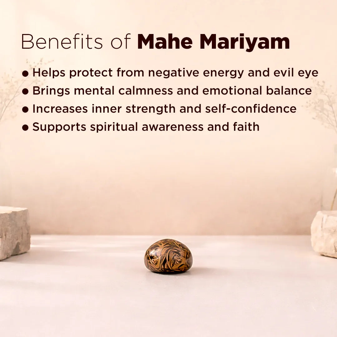 Decorative stone with text listing benefits of Mahe Mariyam on a plain background