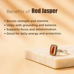 Red jasper ring on a beige surface with text listing benefits of red jasper.