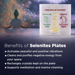 Selenite plate with energy symbols and a person meditating in the background