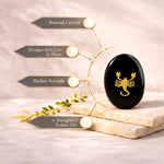 Black crystal with gold scorpion design on a beige background with text about its features.