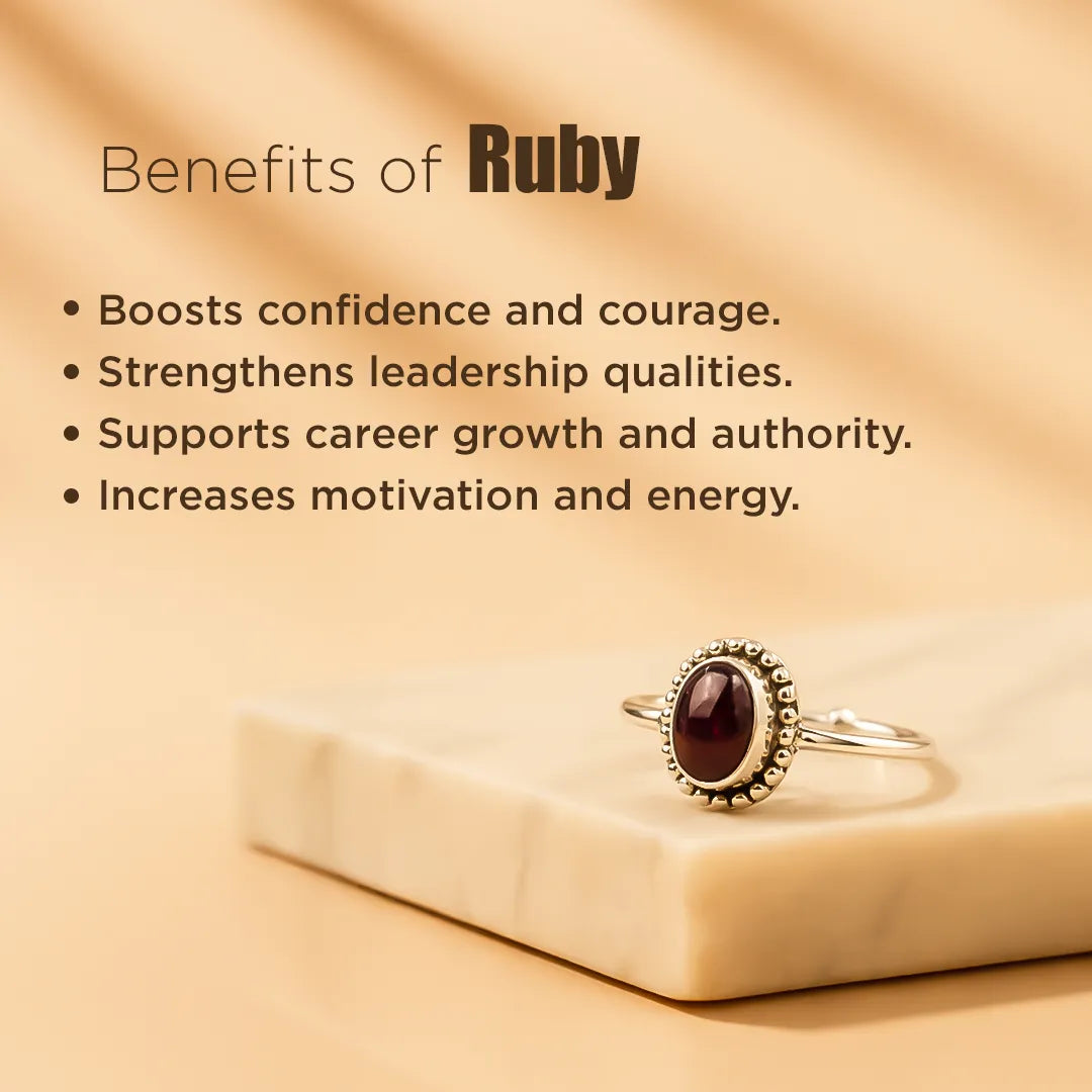 Ruby ring on a beige surface with text about its benefits.Ruby Ring: Boosts Confidence and Leadership