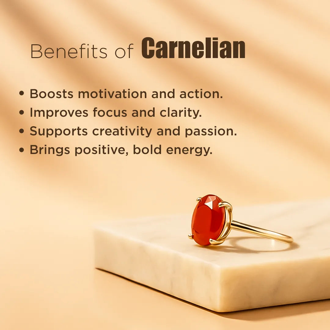 Red gemstone ring on a beige surface with text about the benefits of carnelian.