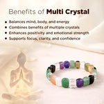 Colorful crystal bracelet with a blurred silhouette of a person meditating on a light background.