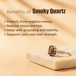 Smoky quartz ring on a beige surface with text about its benefits.