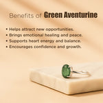 Green aventurine ring on a beige surface with text listing benefits