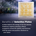 Selenites plates with astrological symbols on a dark background