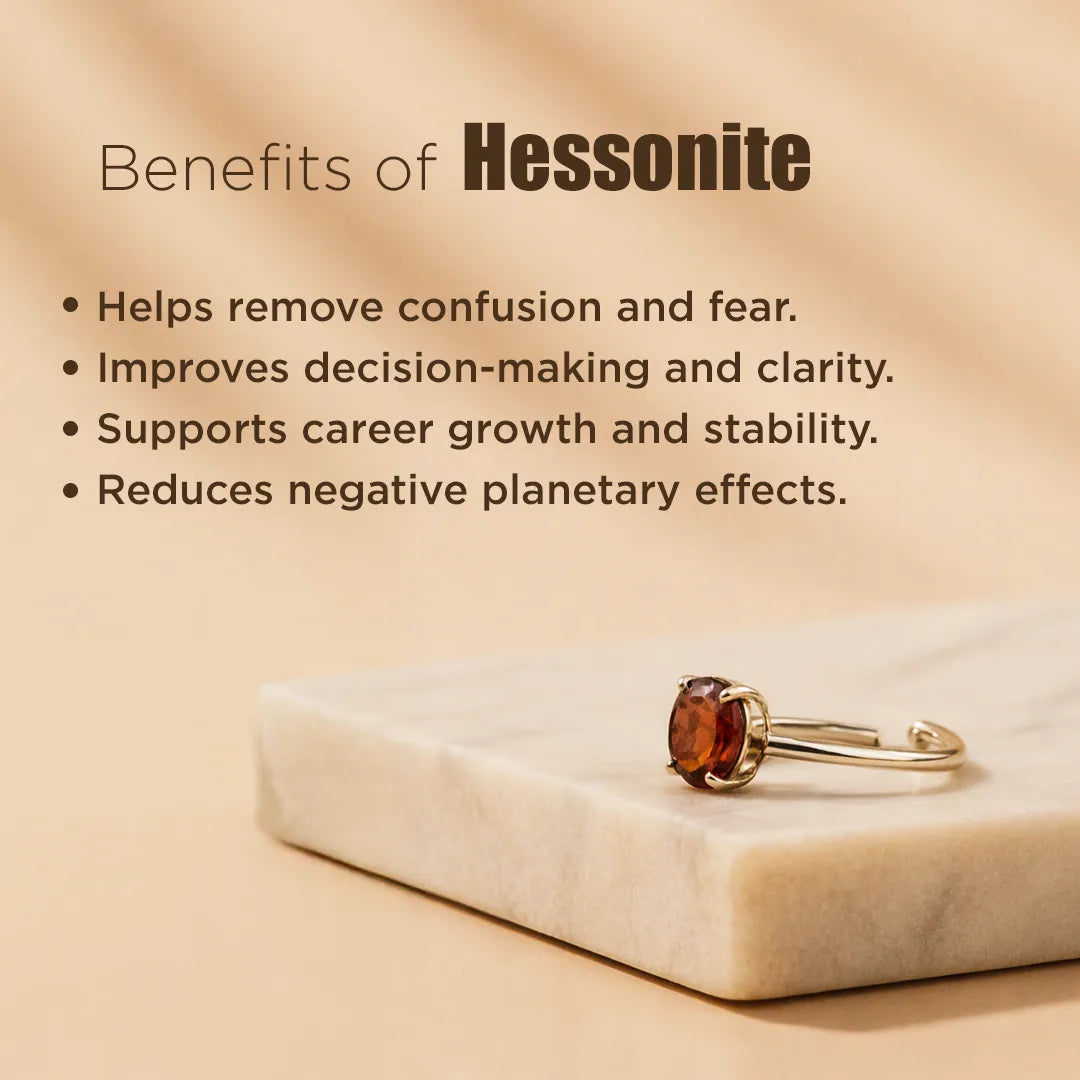 Hessonite ring on a marble surface with text about its benefits.Rahu Hessonite Ring: Protection from Hidden Enemies