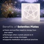 Selenite plate with pentagram design on a reflective surface, surrounded by blurred natural background.