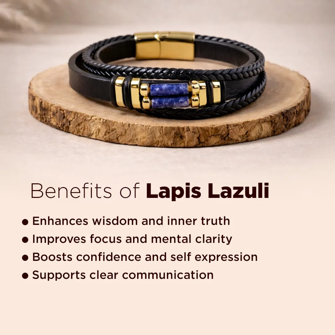Black leather bracelet with gold and lapis lazuli stones on a wooden stand, with text about lapis lazuli benefits.