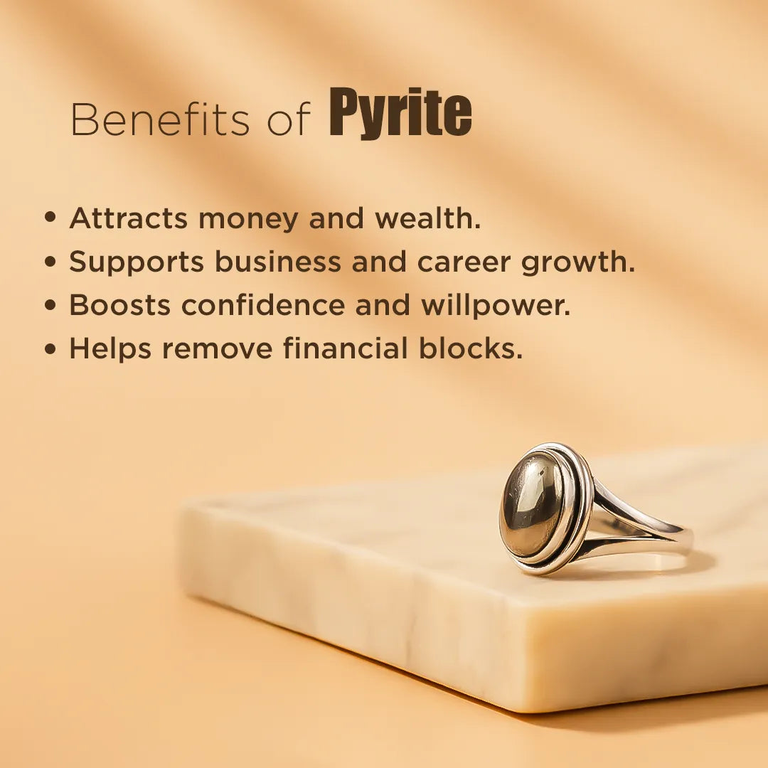Pyrite ring on a beige stone with text listing benefits of pyrite.Pyrite Ring: Attracts Wealth and Abundance