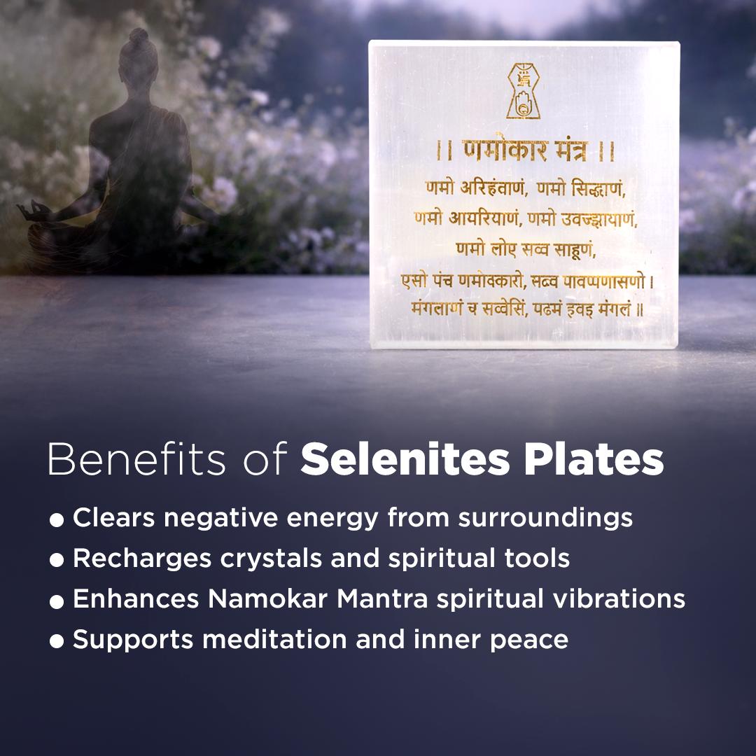 Selenite plate with Namokar Mantra text on a blurred background of a person meditating.
