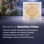 Selenites plate with Kuber Yantra design and benefits listed on a blurred background