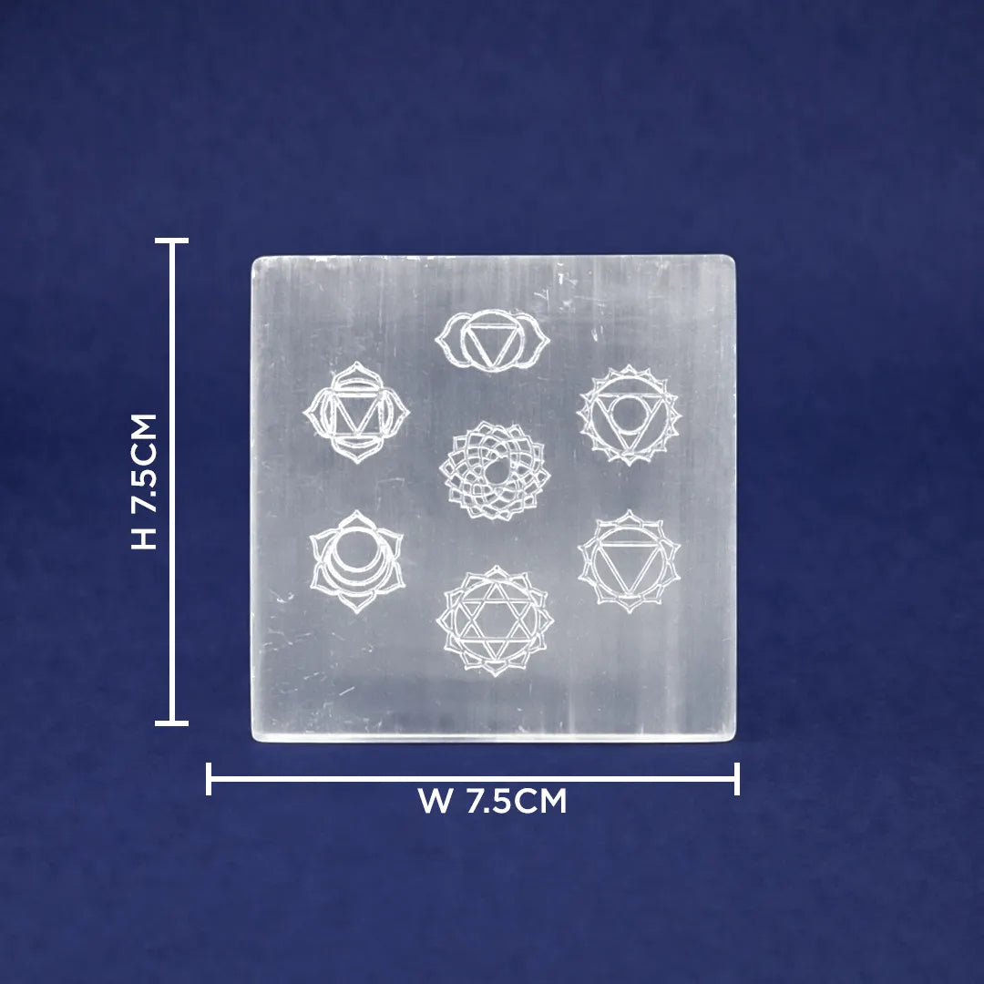 Transparent square crystal with chakra symbols and measurements on a blue background