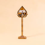 Decorative brass lamp on a beige background