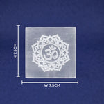 Square crystal with Om symbol and measurements on a blue background
