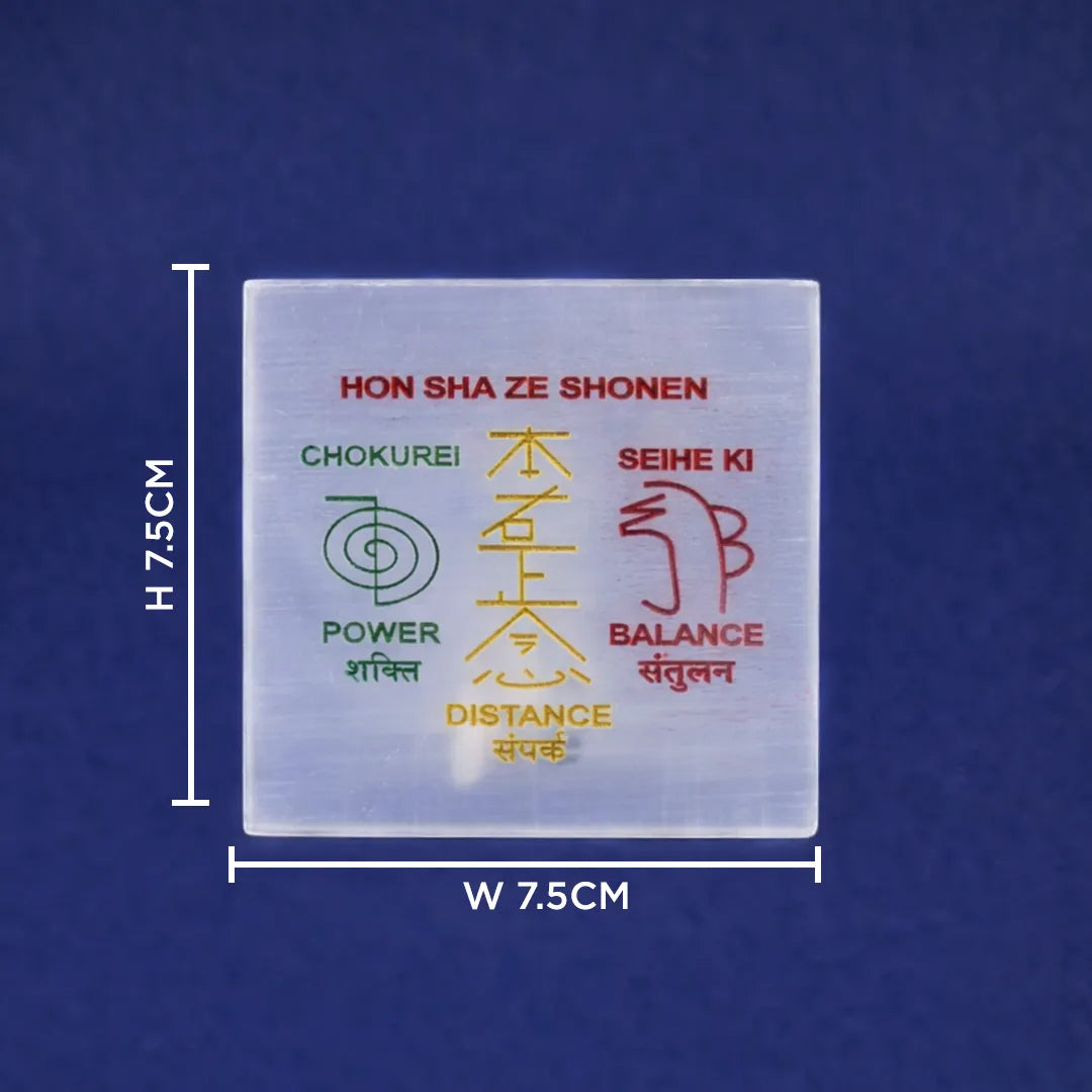 Transparent square object with text and symbols on a blue backgroundReiki Distance Selenite Plate – Square Energy Healing & Charging Plate