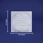 Square crystal with Flower of Life symbol and measurements on a blue background