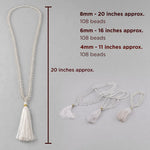 White beaded necklace with tassels and measurement details on a gray background