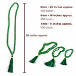 Green beaded necklace with tassels and measurements on a white background