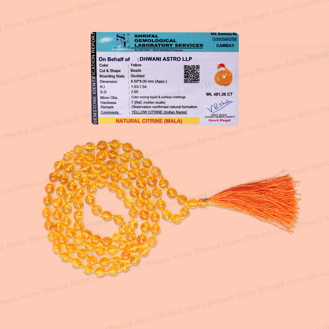 A set of natural citrine (yellow) glass prayer beads with an orange tassel, displayed next to a printed certificate card on a solid peach-pink background.Natural Yellow Citrine Ganth Mala | Prosperity & Abundance Mala | Handknotted Japa Mala for Meditation, Puja & Spiritual Practice