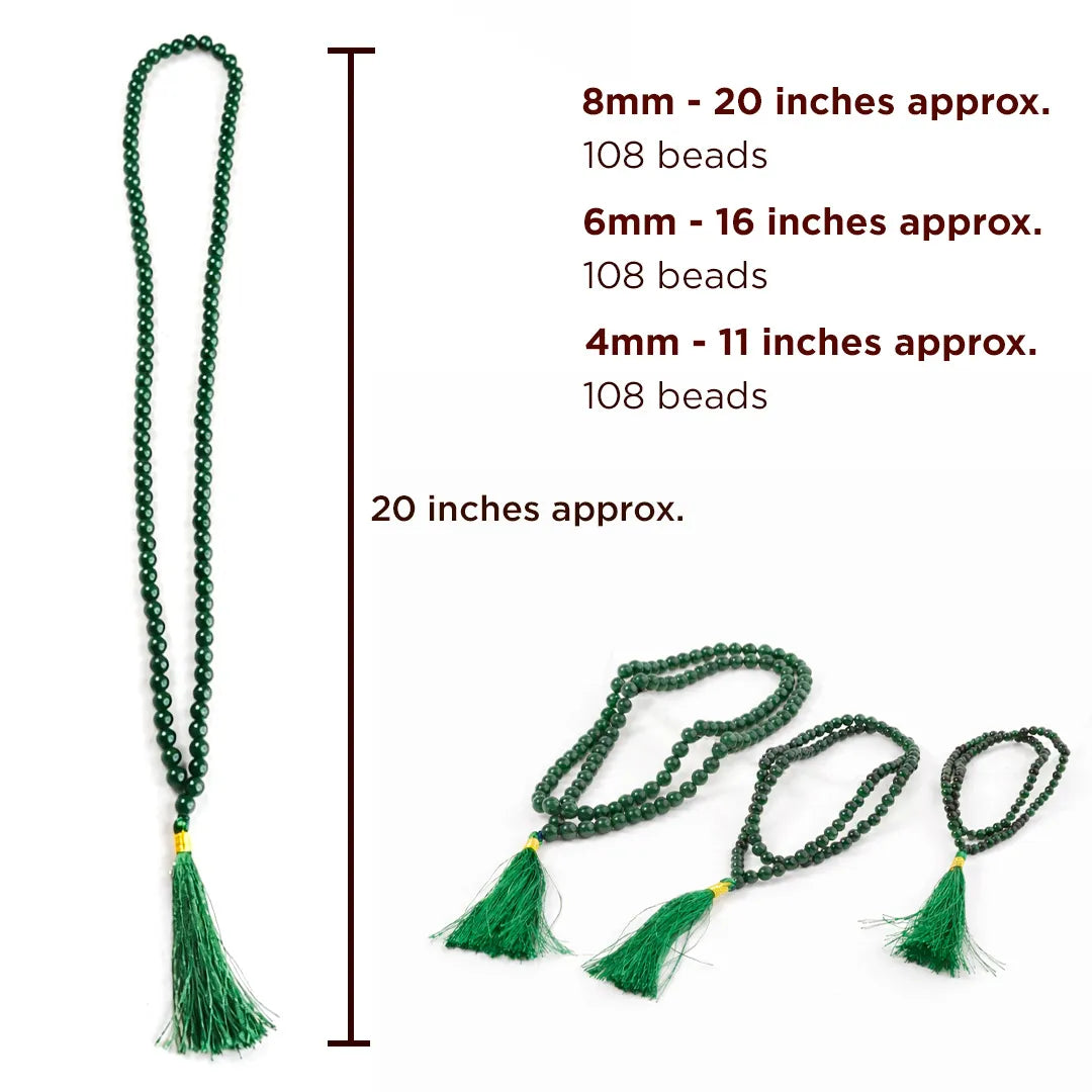 Green beaded necklace with tassels and measurements on a white background