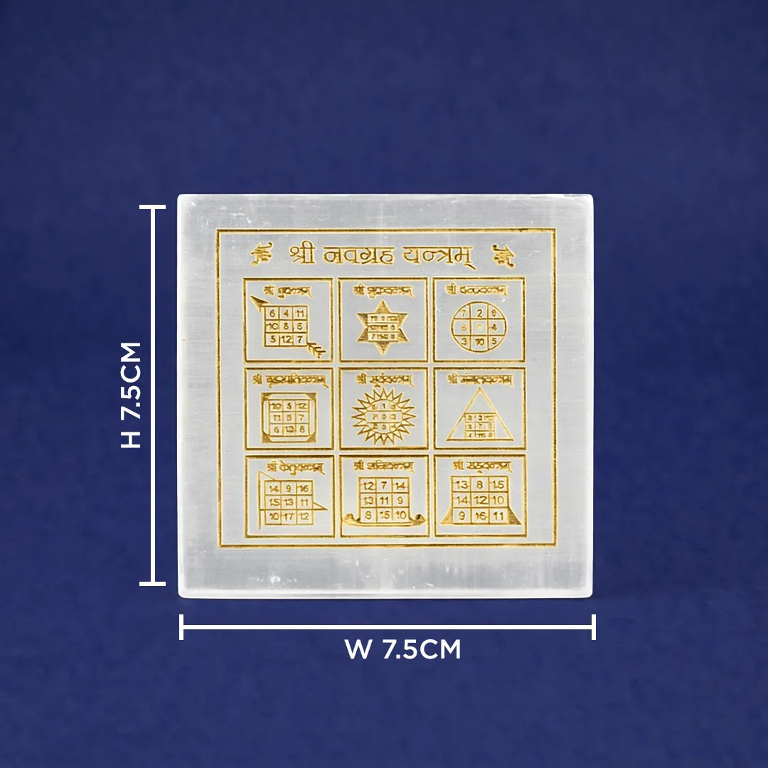 Square white stone with gold symbols and measurements on a blue background