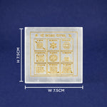 Square white stone with gold symbols and measurements on a blue background