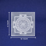 Square crystal with Sri Yantra design and measurements on a blue background