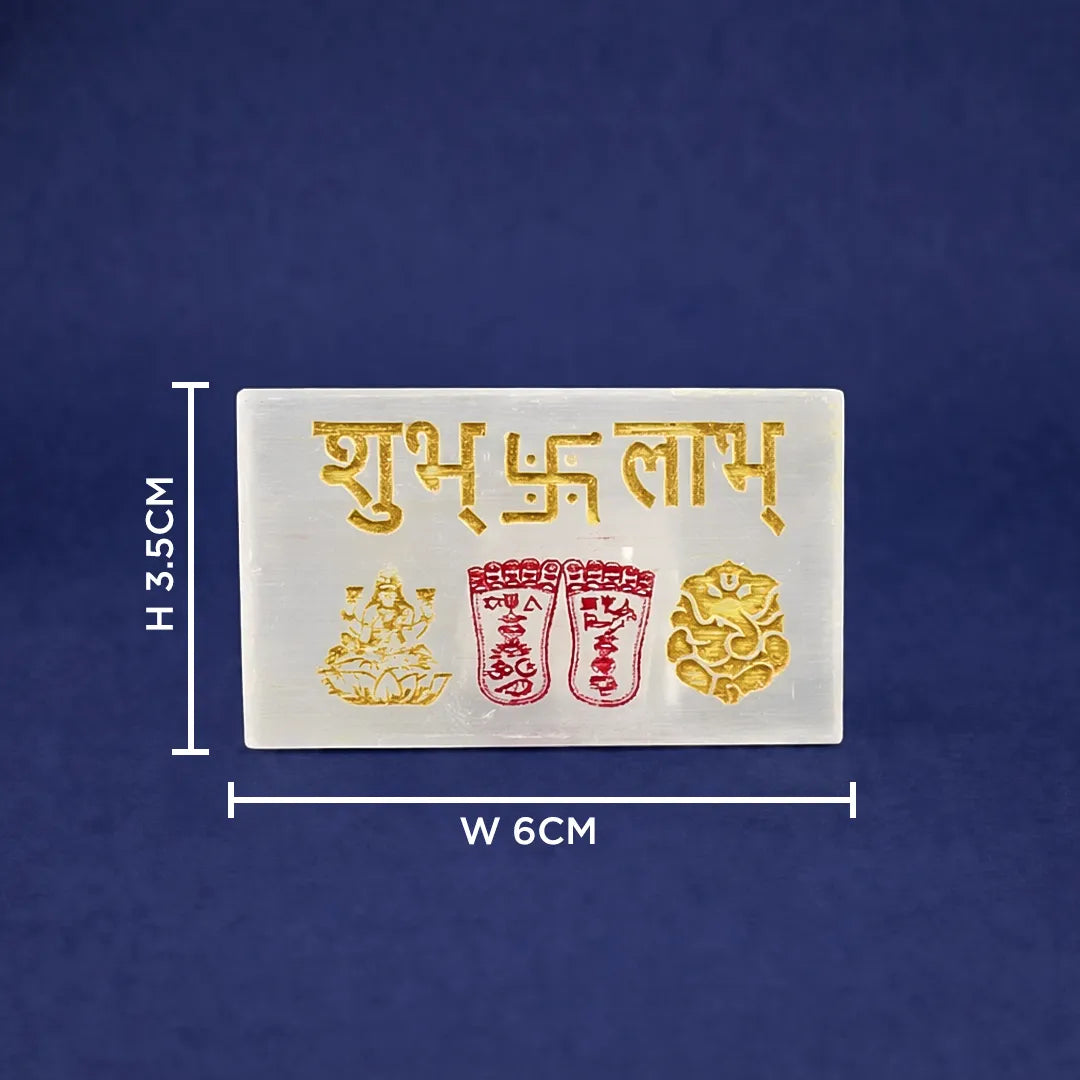 Rectangular white object with gold and red designs and text on a blue background