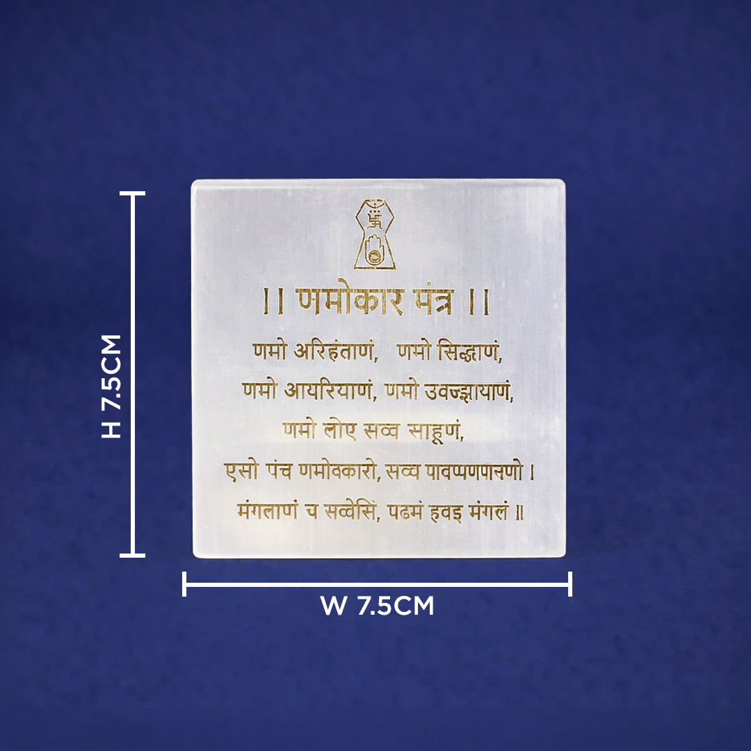 White stone plaque with gold text and measurements on a blue background