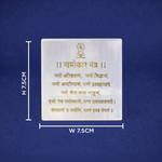 White stone plaque with gold text and measurements on a blue background