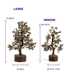 Two artificial trees, one large and one medium, with measurements indicated.