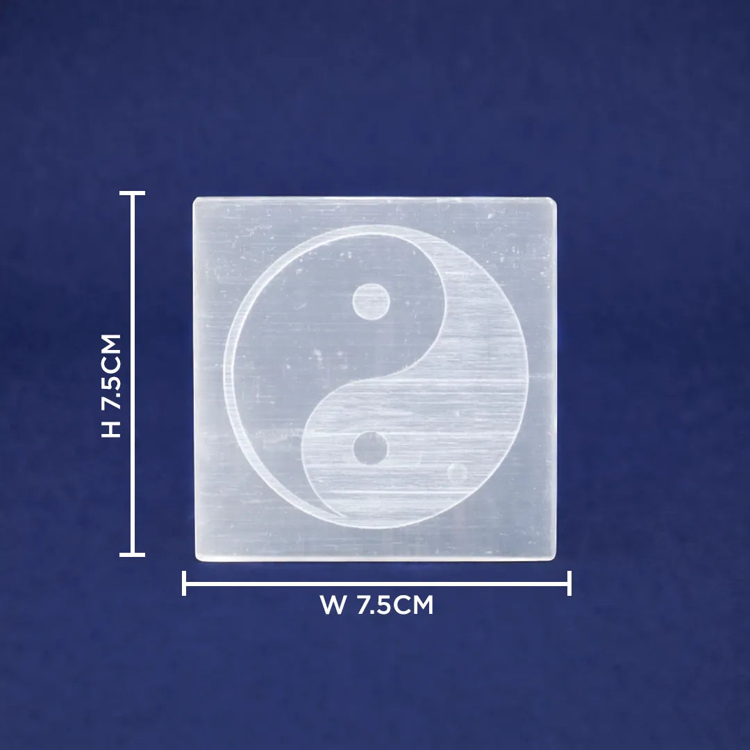 Square transparent block with yin yang symbol and measurements on a blue background