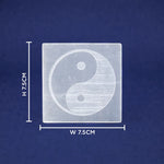 Square transparent block with yin yang symbol and measurements on a blue background